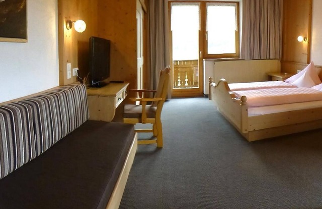 Habitación triple "Holzleiten" con sala de estar - Pension Alpenhof - Pensión de bienestar
