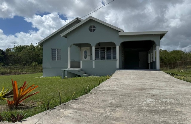 Tropical Bliss Retreat – 3BR Oasis near Beach, St. John’s & Airport