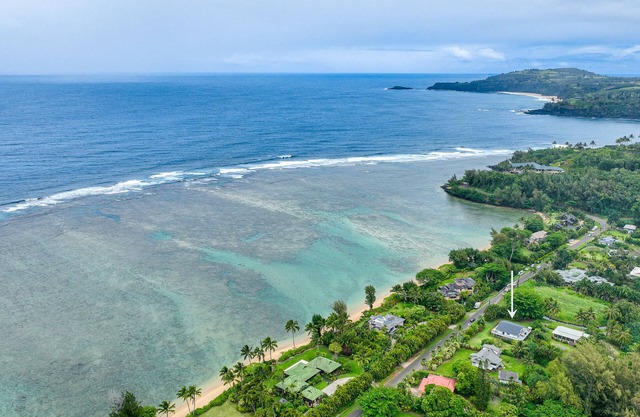 Tropical home across from Anini Beach with amazing deck & small ocean view