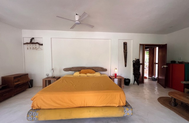 Tropical Sanctuary, with private garden, hanging seats and fire pits.