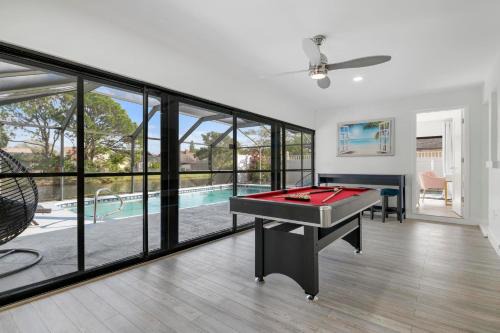 Tropical Tranquility! Luxury pool home with lakefront view just minutes from the beach!