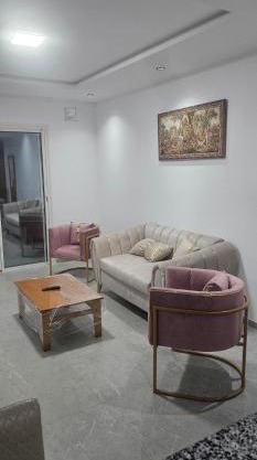 two-bedroom apartment with a living room, kitchen and balcony