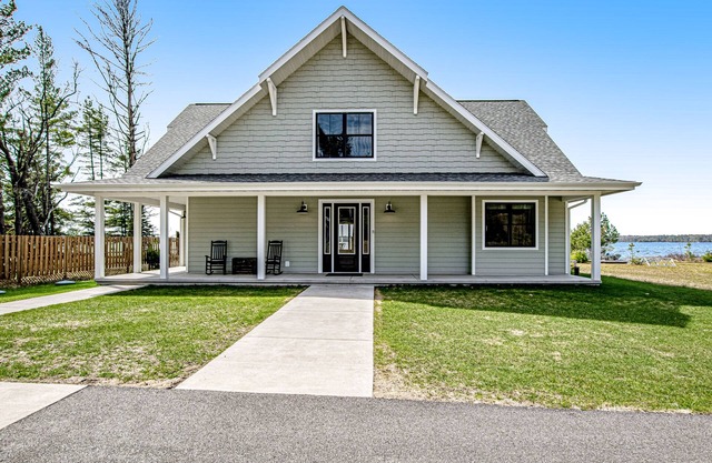 Two dog-friendly lakefront homes with docks, kayaks, rowboat, firepits & beach