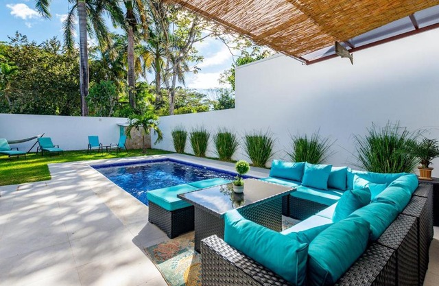 Ultramodern Townhome with an Inviting Coastal Design and Lush Outdoor Oasis with a Private Pool