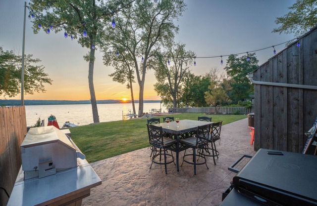 Unique riverfront home w/ beach, dock, watersports, firepit, hot tub, and sauna!