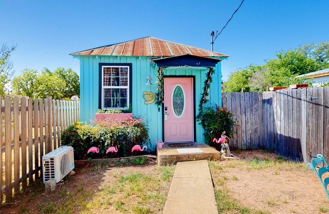 Unique themed home with full kitchen, central AC, patio, & W/D