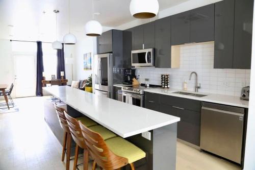Upscale 2BR Condo w Patio City Views Walk to DT