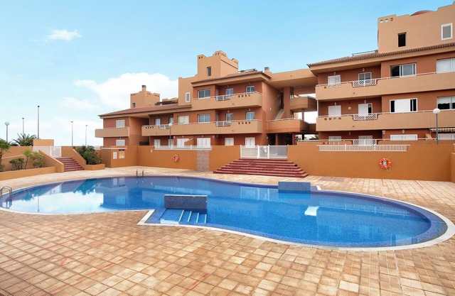 Apartamento de vacaciones 'Beach Front Puertito' con piscina compartida, terraza privada y Wi-Fi