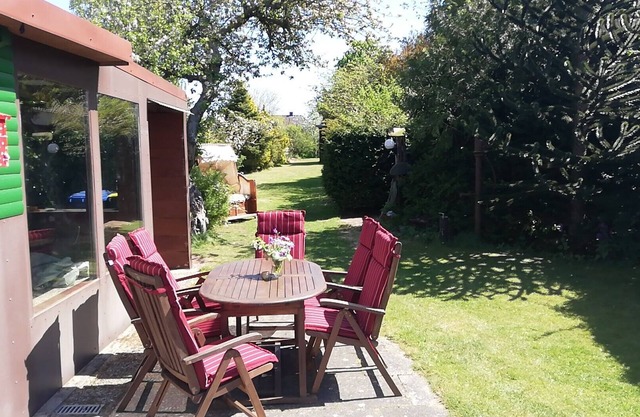 Vacation home with wooden floor, fenced property for a relaxing vacation.