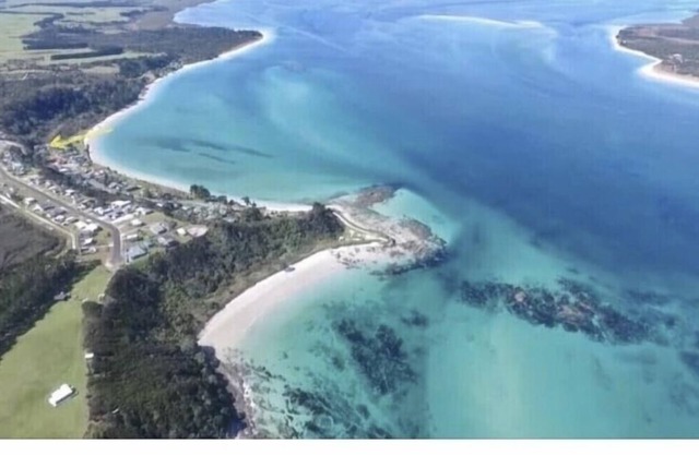 Very close to the beach, right in the heart of Rangiputa