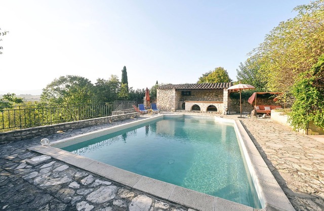 Very pretty stone village house with tasteful furnishings and communal pool.