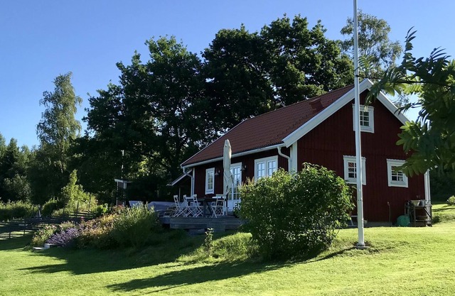 View of lake and mountains in west orientation, with sauna and jetty