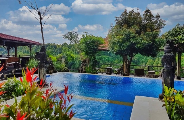 Villa Ayu offers stunning view over mountains green valley with waterfall