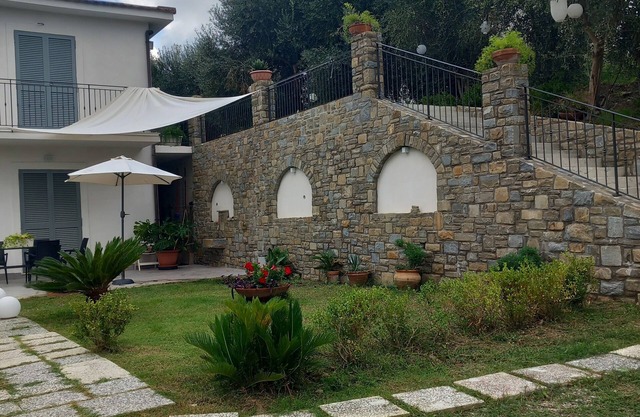 Villa between olive groves and the sea