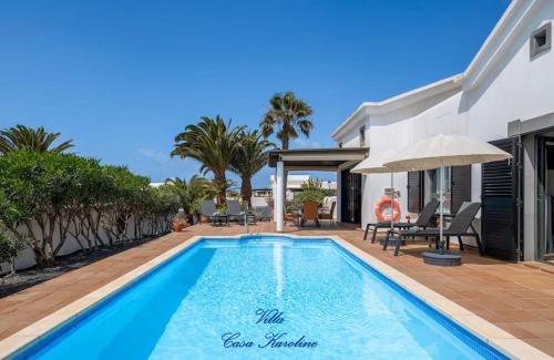 Villa Casa Karoline with a sunny terrace, heated pool, comfort and privacy in a quiet neighborhood