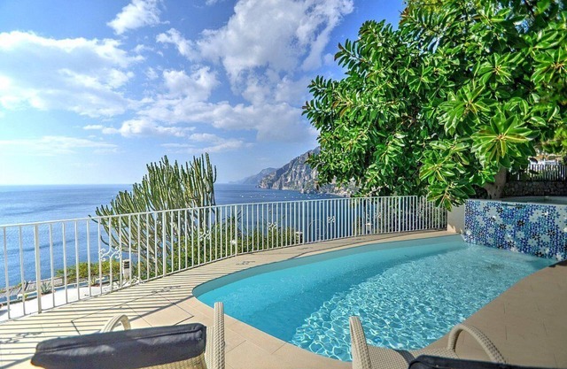 Villa Cleopatra Grande, fully refundable with voucher*: An elegant and welcoming two-story villa built sheer above the sea, with Free WI-FI.