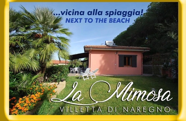 HERMOSA VILLA CON JARDÍN A POCOS PASOS DE LA PLAYA: Dimora "La Mimosa"