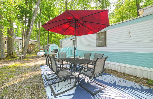 Walk to Manistee Lake: Retro Cottage w/ Fire Pit!