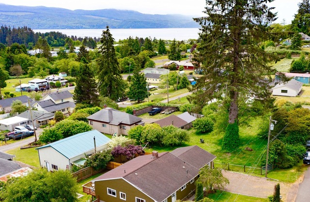 Water view retreat with scenic deck, grill, yard, fireplace, board games, & W/D