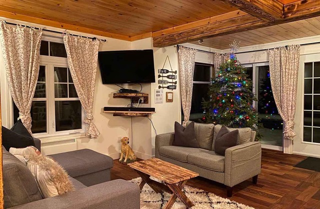 Waterfront cottage with private spa, blending rustic and contemporary charm.