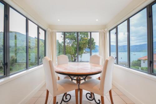 Waterfront Akaroa Retreat with Harbour Views & Balcony
