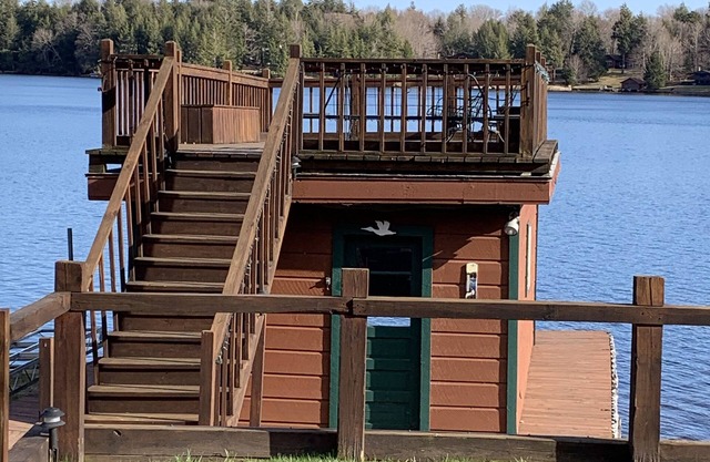 Waterfront Camp with Boathouse - Wifi, kayaks, canoe and sandy bottom out front.