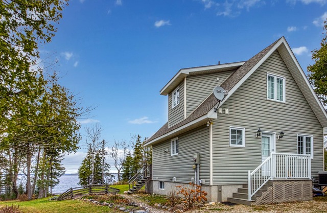 Waterfront, chalet style home; minutes walk to the beach