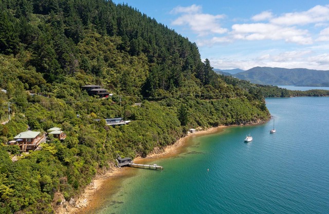 Waterfront cottage nestled in native bush with epic views