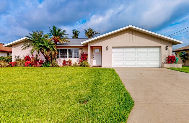 Waterfront home with an enclosed pool, outdoor kitchen, and grill - dog-friendly