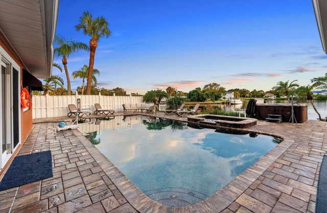 Waterfront Oasis w/ Pool, Spa, Boat & Jet ski Dock, Game Room & Outdoor Kitchen