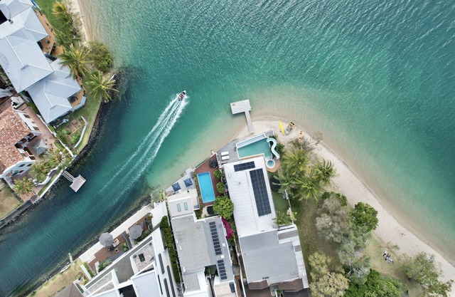 Waterfront @ Palm Beach pool with slide a tinny canoe & Kayak prime position.
