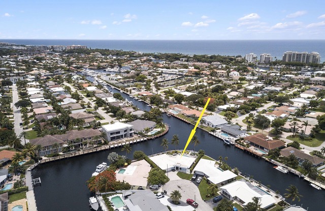 Waterfront retreat with heated pool, firepits, & boat access. C