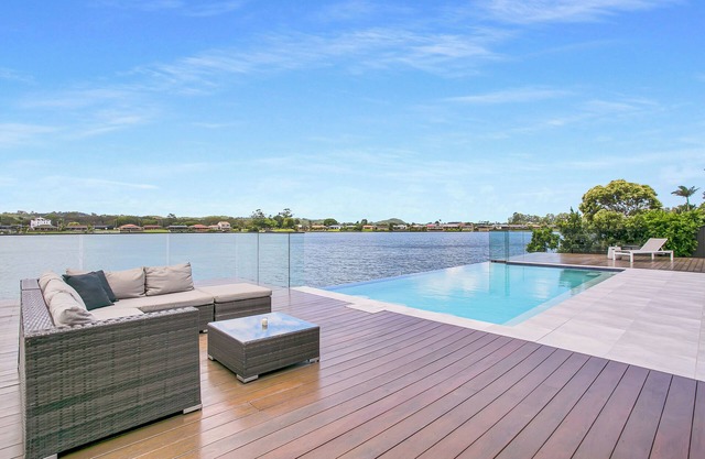 Waterfront Retreat with Infinity Pool & Canal Views