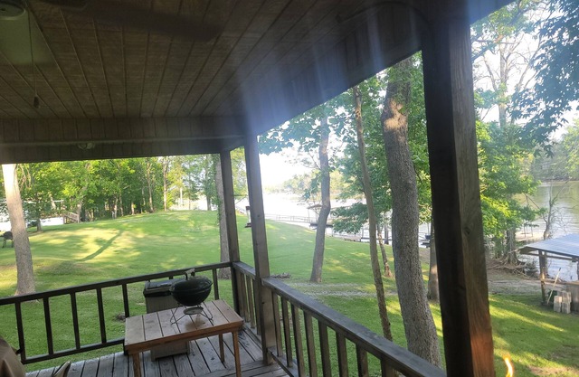 Weekend getaway at scenic Black River Lake with floating dock and boathouse.
