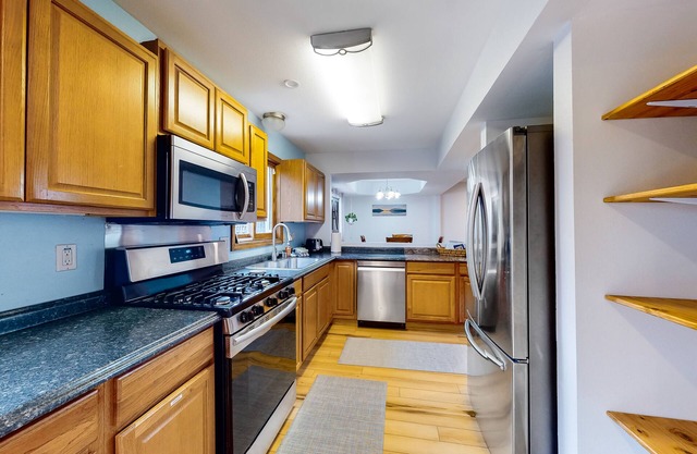 Welcoming home with full kitchen, gas grill, private deck, fast WiFi, & W/D