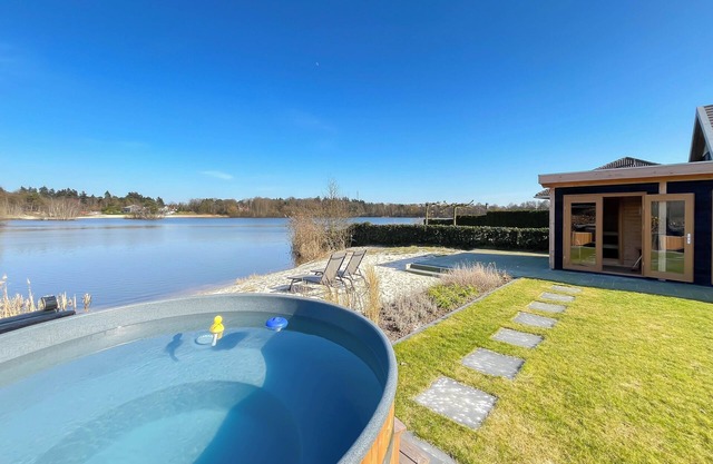 Wellness house by the water with sauna, hot tub, and private beach