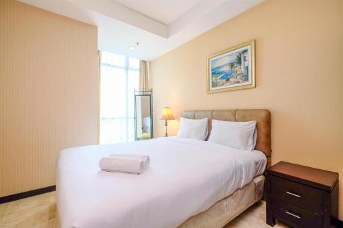 Wonderful and Homey 2BR Apartment Bellagio Residence By Travelio