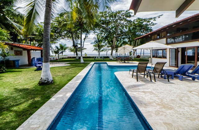 Wonderful beachfront property in Tivives with palm trees, private pool, and AC