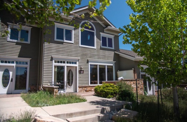 Woodsy, lodge-style condo with stellar views of the Rockies!