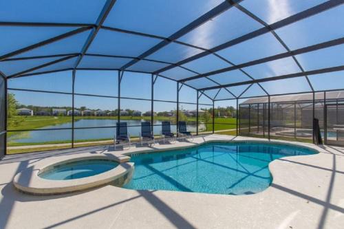 Kissimmee Villa | #372-Welcome to Lightwater Villa, your Modern Disney Vacation home! South-Facing Pool & Spa Overlooking Lake