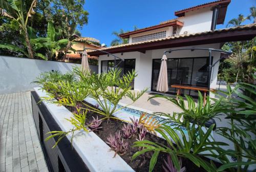 Costa do Sol Casa | 50m praia Cond pé na areia Alto padrao 4 suites Segur 24h Costa do sol Guaratuba Bertioga prox Riviera