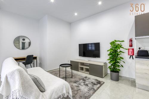 Il-Balluta Apartamento | A lovely 1BR home with Balcony just off the coast by 360 Estates