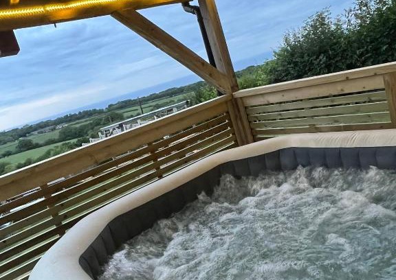 Llanasa Hotel | Angies Den - quirky cabin with hot tub & views