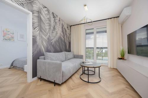 Wlochy Apartamento | Beige Apartment in Warsaw with Parking and Air Conditioned Living Room by Noclegi Renters