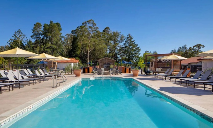 Live Oak Hotel | Cozy Sanctuary: Fireside, Pool, and Nature Trails for Your Discovery