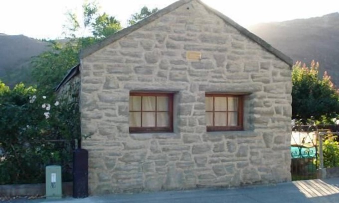 Clyde Condominio | Cabaña de piedra histórica