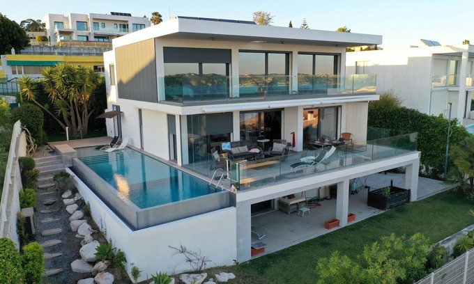 Linda-a-Velha Villa | Lisbon 3 floor 3 bedroom Villa, unique Sea View, Infinity Pool, Terrace, and Gym