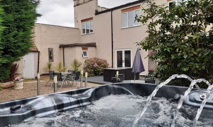 Kneesall Cabaña | Relax and unwind at our hot tub retreat, close to activities, trails, water park