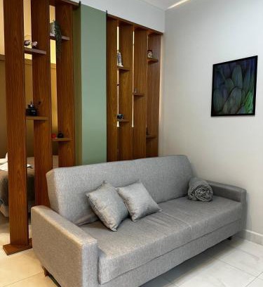 Regiao Urbana Homogenea X Apartamento | Studio Aconchego Poços - Minimalista e bem localizado