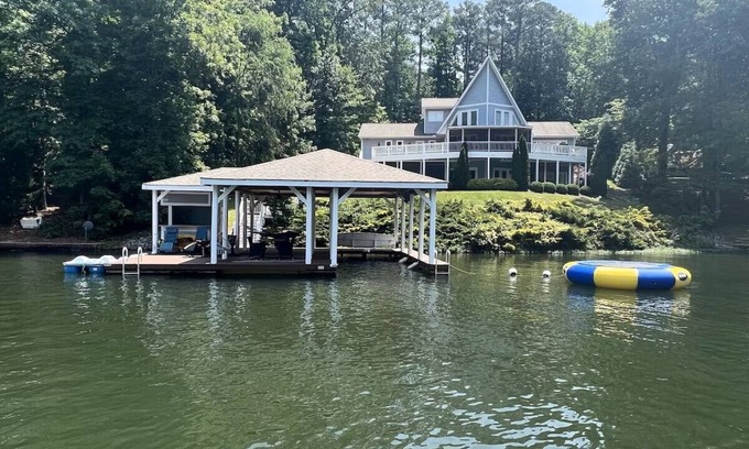 Littleton Casa | Stylish & Fresh Gaston Lakefront Retreat – Water Trampoline, Hot Tub, Family Fun